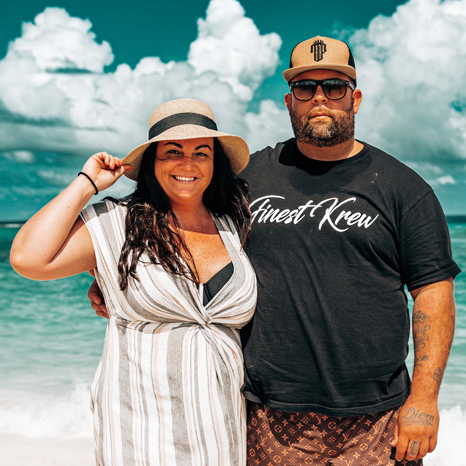 Ryan and Meghan, co-founders of Bare & Basic premium reusable nipple covers standing on a beach with ocean waves in the background